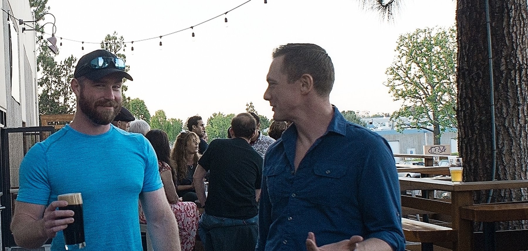 John Bush in conversation at a social gathering